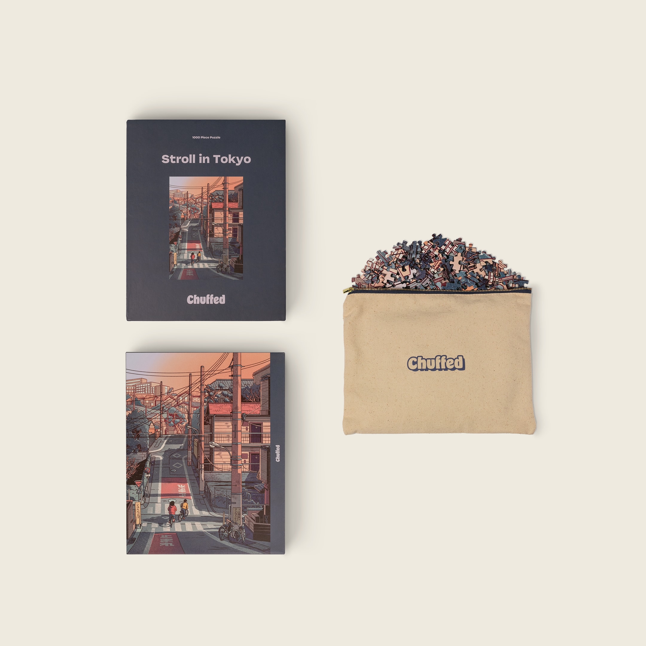 Stroll in Tokyo box, art print, and pouch filled with puzzle pieces
